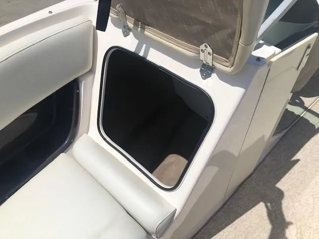 Slide: The Image of Regal 2200 Bowrider 2004, open storage compartment in boat. - 10