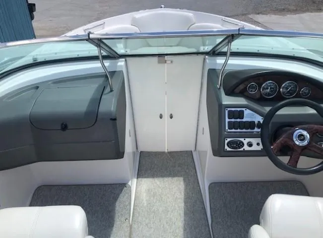 Slide: The Image of Interior view of 2004 Regal 2200 Bowrider boat, cockpit and helm area. - 11