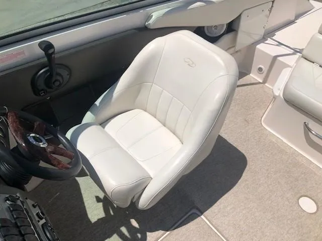 Slide: The Image of Interior of a 2004 Regal 2200 Bowrider with white seat. - 16