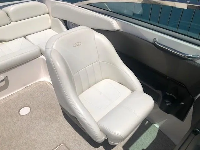 Slide: The Image of Interior of a 2004 Regal 2200 Bowrider with white leather seats. - 19