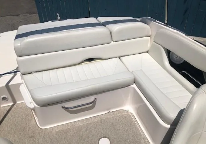 Slide: The Image of Interior of a 2004 Regal 2200 Bowrider with white upholstered seats. - 21