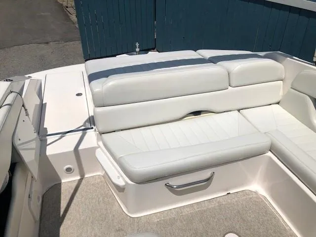 Slide: The Image of Interior of 2004 Regal 2200 Bowrider with white seating. - 22