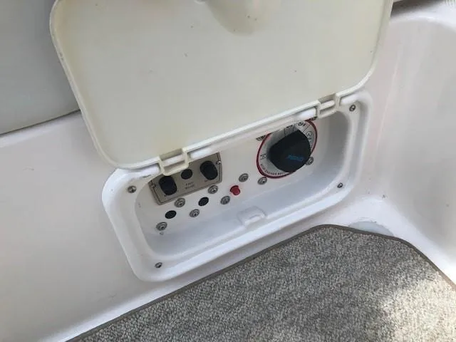 Slide: The Image of Regal 2200 Bowrider 2004 control panel with cover. - 26
