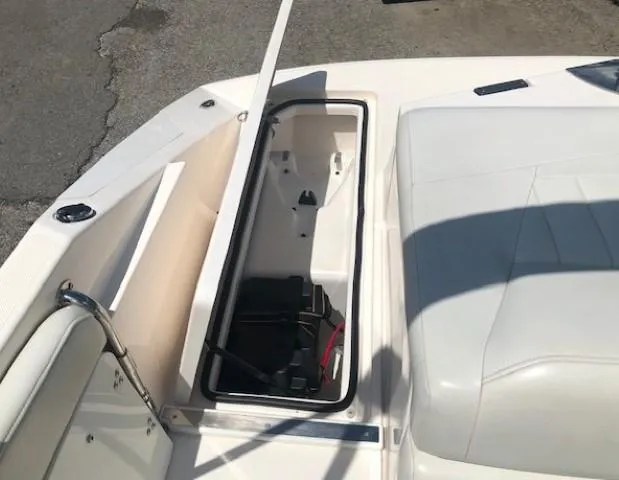 Slide: The Image of 2004 Regal 2200 Bowrider with open storage compartment on deck. - 28
