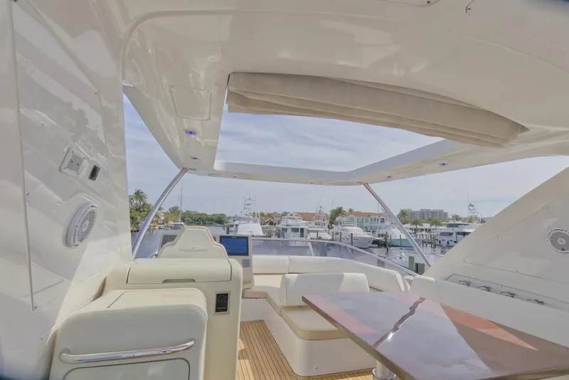Slide: The Image of Luxurious 2015 Azimut 64 Flybridge yacht interior with modern seating and panoramic views. - 10