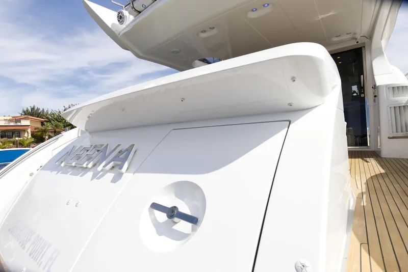 Slide: The Image of 2015 Azimut 64 Flybridge yacht stern view with deck and sky background. - 16