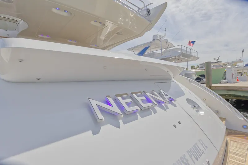 Slide: The Image of 2015 Azimut 64 Flybridge yacht docked, rear view with NEENA nameplate. - 17