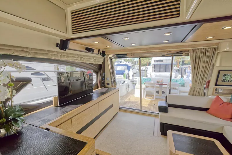 Slide: The Image of Luxurious interior of 2015 Azimut 64 Flybridge yacht with modern furnishings. - 20