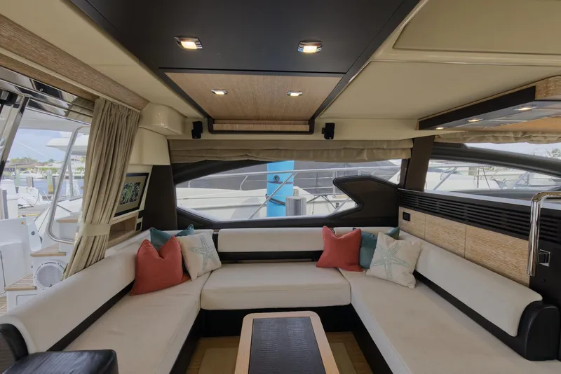 Slide: The Image of Luxurious interior of 2015 Azimut 64 Flybridge yacht with spacious seating area. - 22