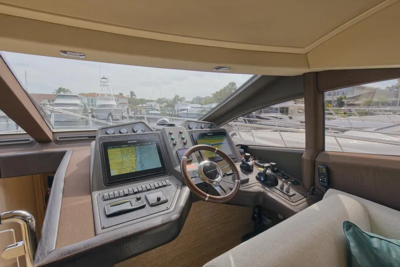 Slide: The Image of Interior helm of 2015 Azimut 64 Flybridge yacht with navigation screens and controls. - 29