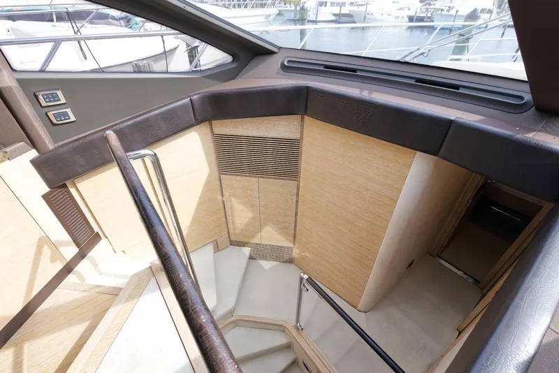 Slide: The Image of Interior staircase of 2015 Azimut 64 Flybridge yacht with modern wood finish. - 30