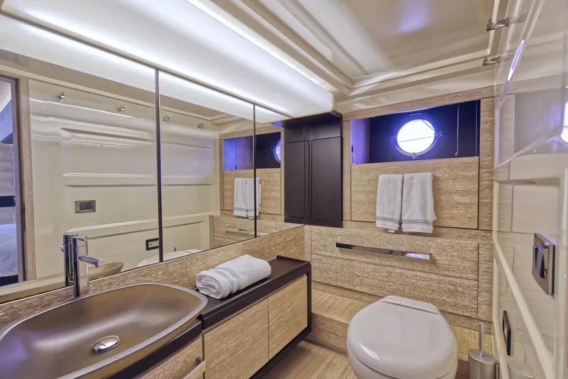 Slide: The Image of Luxurious bathroom in 2015 Azimut 64 Flybridge yacht with modern fixtures and elegant design. - 34