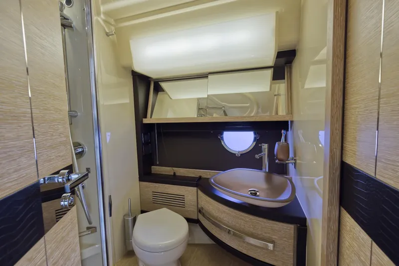 Slide: The Image of Luxurious bathroom in a 2015 Azimut 64 Flybridge yacht with modern fixtures. - 38