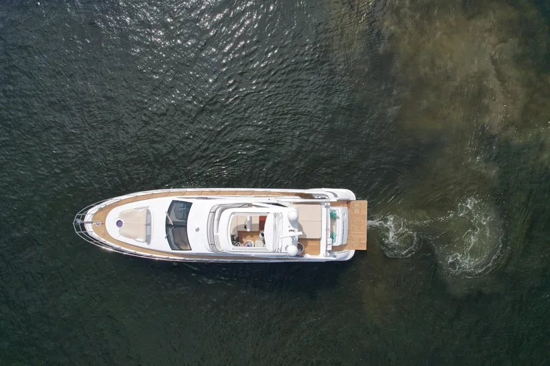 Slide: The Image of Aerial view of 2015 Azimut 64 Flybridge yacht cruising on water. - 6