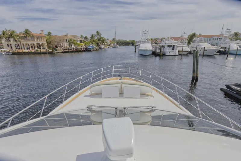 Slide: The Image of View from the bow of a 2015 Azimut 64 Flybridge yacht in a marina. - 7