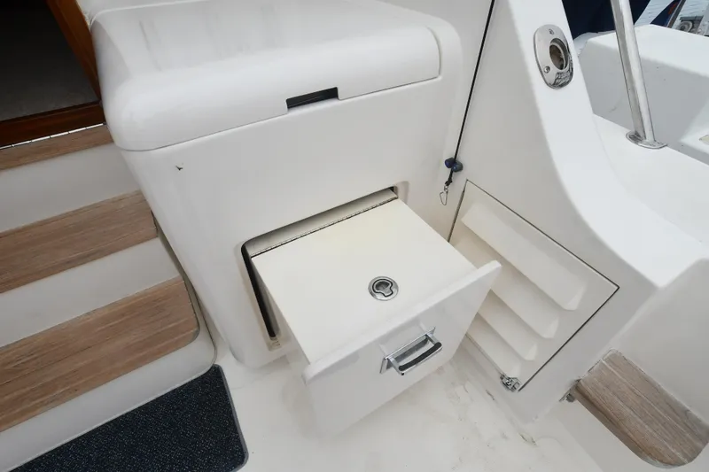 Slide: The Image of 1988 Bertram 54 Convertible boat interior with storage drawer and steps. - 14