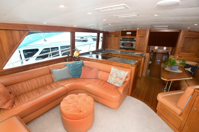 Slide: The Image of Luxurious interior of 1988 Bertram 54 Convertible yacht with leather seating and modern kitchen. - 26