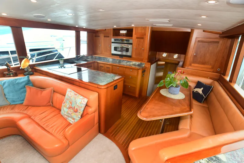 Slide: The Image of Luxurious interior of 1988 Bertram 54 Convertible yacht with leather seating and modern kitchen. - 29