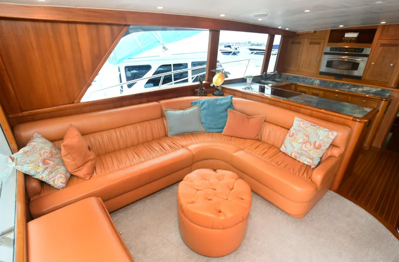 Slide: The Image of Luxurious interior of a 1988 Bertram 54 Convertible yacht with leather seating and modern kitchen. - 30