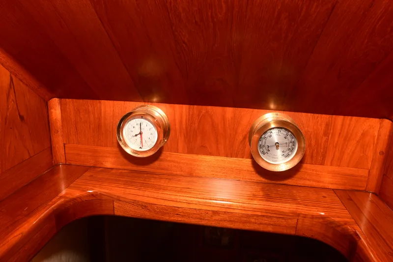Slide: The Image of Wooden interior of 1988 Bertram 54 Convertible with brass gauges. - 38