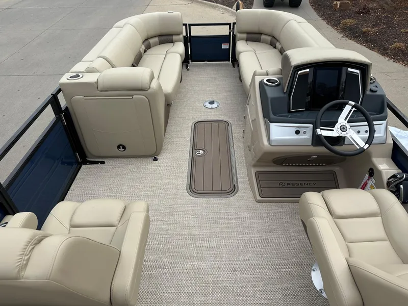 Slide: The Image of 2023 Regency 230 LE3 pontoon boat with beige seating and modern helm. - 4