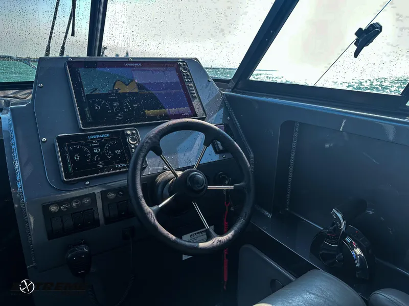 Slide: The Image of Helm with Lowrance Electronics - 12