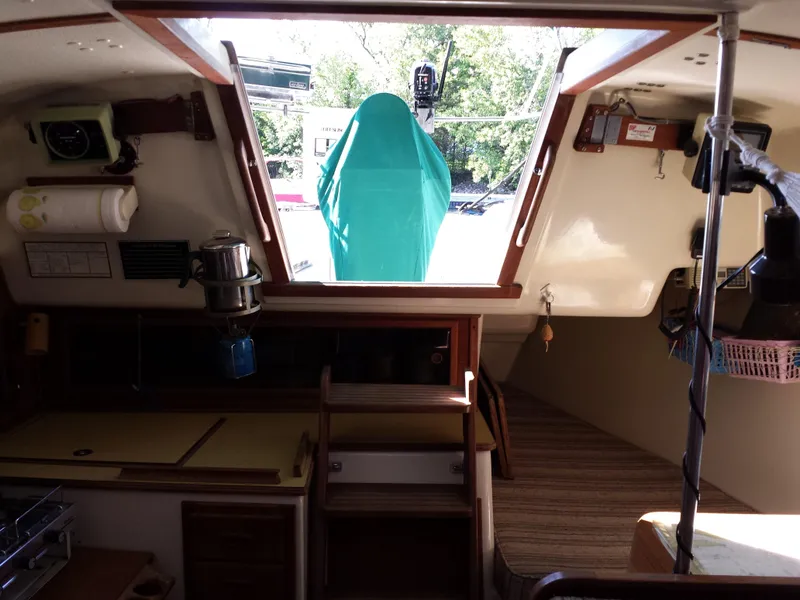 Slide: The Image of Interior of 1983 Watkins 32 sailboat with open hatch and visible deck. - 13