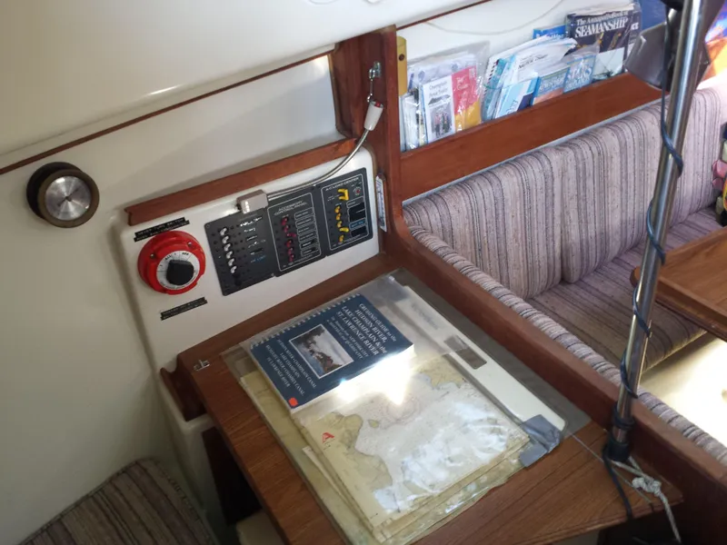 Slide: The Image of Interior of 1983 Watkins 32 sailboat with navigation station and seating area. - 17