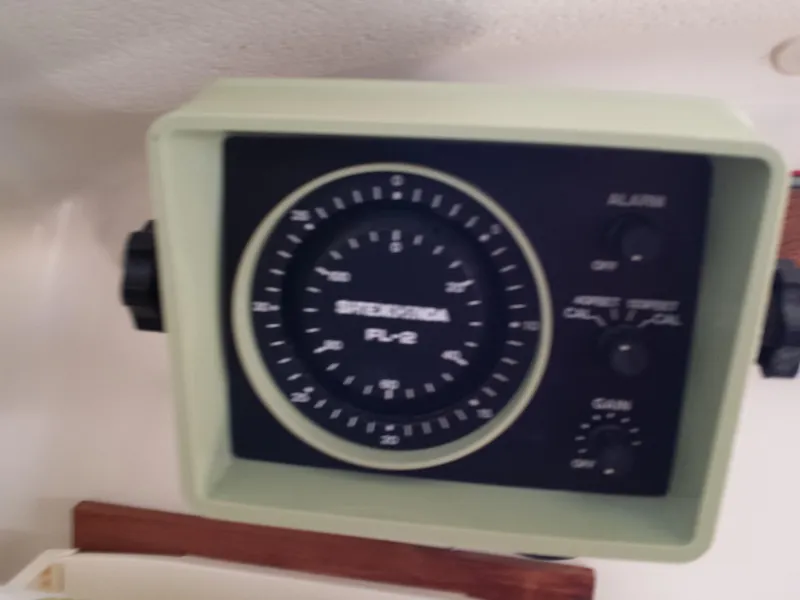 Slide: The Image of 1983 Watkins 32 boat instrument panel with speedometer and controls. - 19