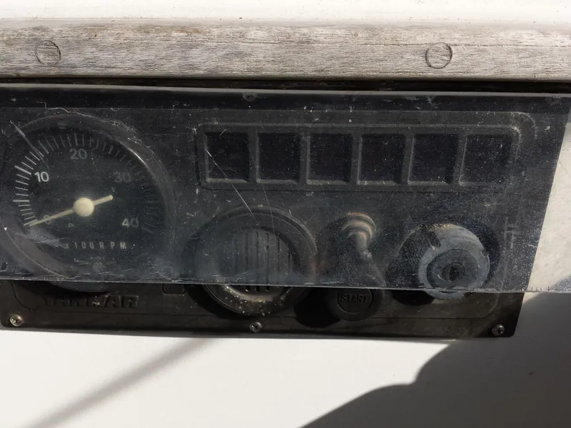 Slide: The Image of Control panel of a 1983 Watkins 32 boat with gauges and switches. - 20