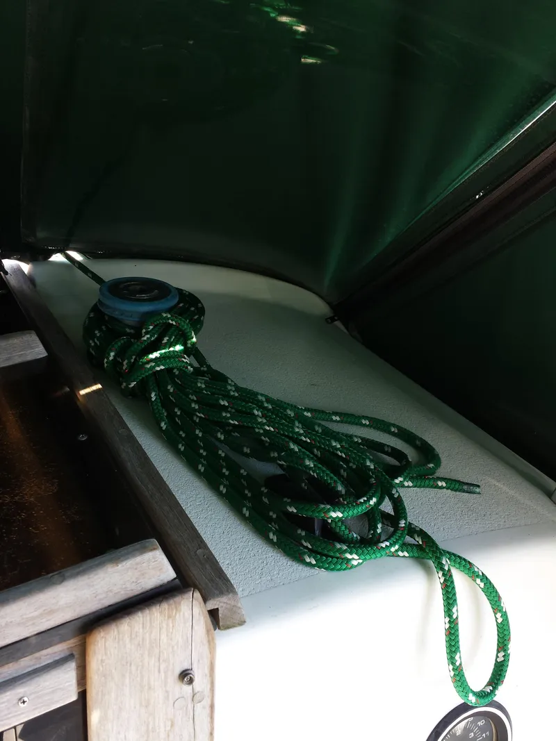 Slide: The Image of Green rope on deck of 1983 Watkins 32 sailboat under green canopy. - 6