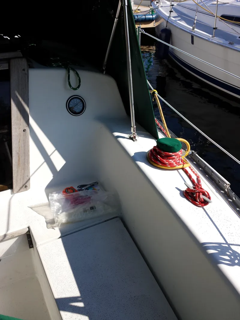 Slide: The Image of 1983 Watkins 32 sailboat cockpit with ropes and nautical equipment. - 9