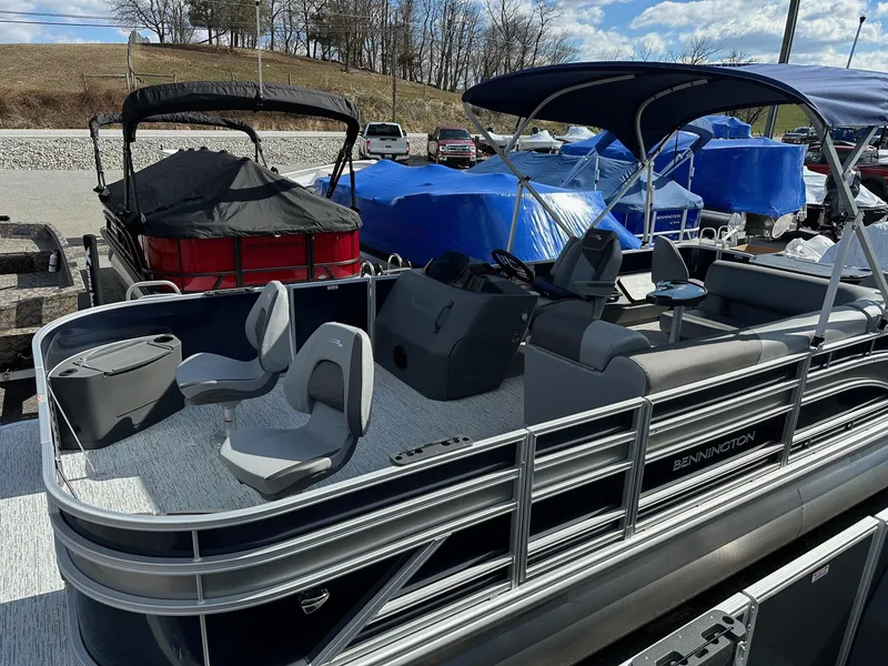 Slide: The Image of 2025 Bennington 22 SF Family Pontoon with four fishing seats, in stock, outdoor display. - 11