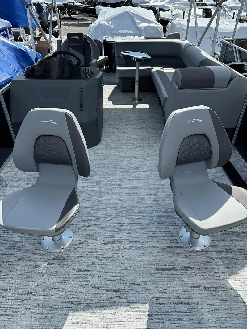 Slide: The Image of 2025 Bennington 22 SF pontoon boat with four fishing seats and spacious seating area. - 13