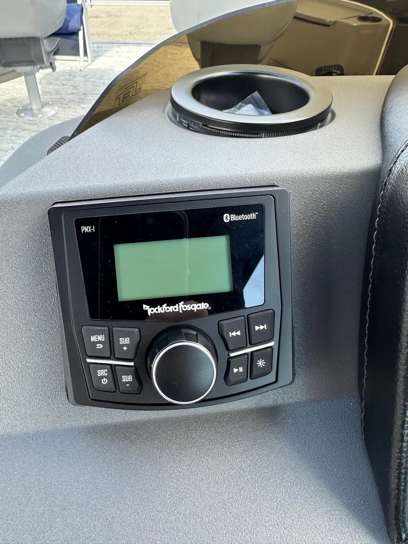 Slide: The Image of Rockford Fosgate Bluetooth stereo on 2025 Bennington 22 SF pontoon boat dashboard. - 17