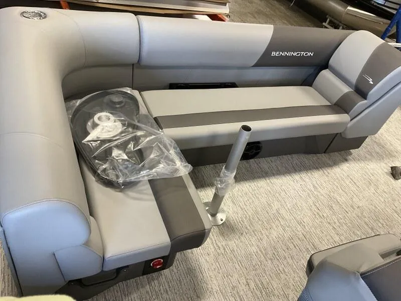 Slide: The Image of 2025 Bennington 22 SF Family Pontoon seating with fishing setup, gray upholstery. - 22