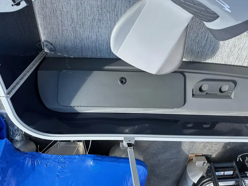 Slide: The Image of 2025 Bennington 22 SF pontoon boat interior with fishing seat and storage compartment. - 40