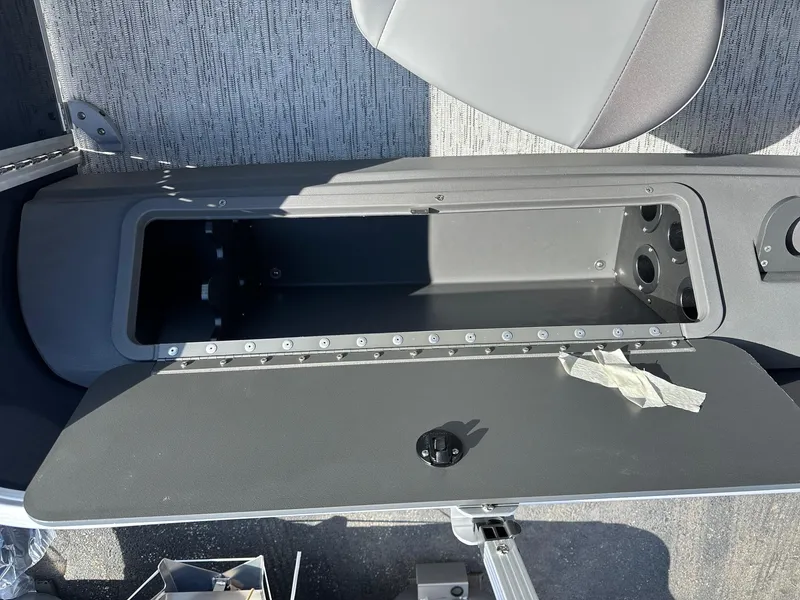 Slide: The Image of Open storage compartment on 2025 Bennington 22 SF Family Pontoon boat. - 41