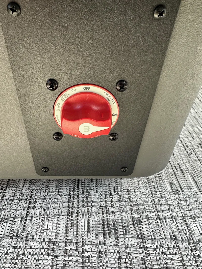 Slide: The Image of Red battery switch on 2025 Bennington 22 SF Family Pontoon boat. - 42