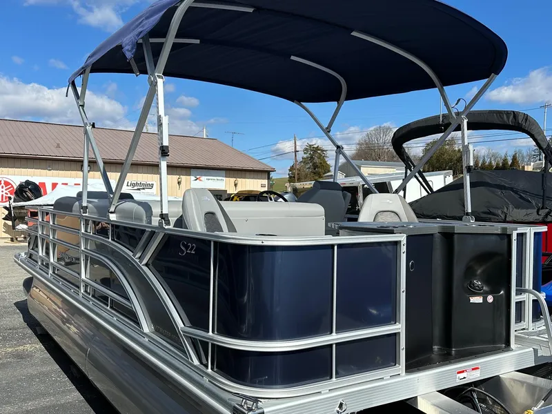 Slide: The Image of 2025 Bennington 22 SF Family Pontoon with canopy, featuring four fishing seats. - 9