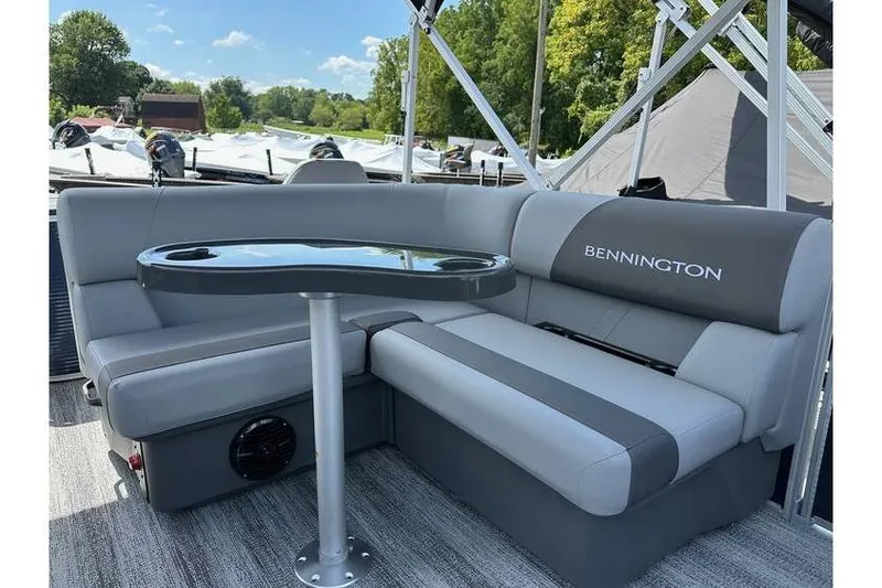 Slide: The Image of Bennington 20 SS Family/Fishing boat interior with gray seating and table, 2026 model. - 15