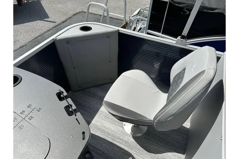 Slide: The Image of 2026 Bennington 20 SS boat interior with gray seating and fishing setup. - 19