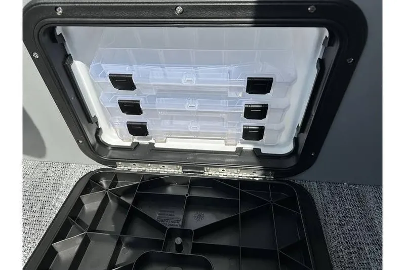 Slide: The Image of Storage compartment with tackle boxes in a 2026 Bennington 20 SS Family/Fishing boat. - 20