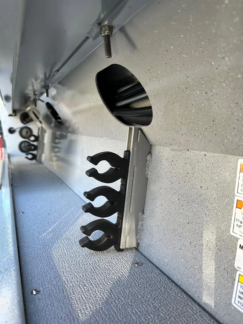 Slide: The Image of Interior view of 2026 Smoker Craft Phantom 18 X2 boat with rod holders. - 13