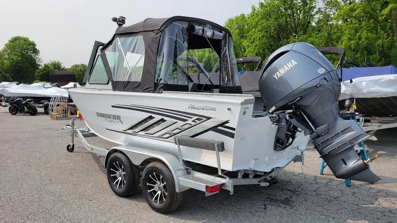 Slide: The Image of 2026 Smoker Craft Phantom 18 X2 boat with Yamaha 150 hp engine on trailer. - 14