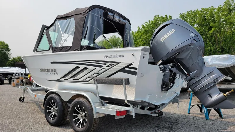 Slide: The Image of 2026 Smoker Craft Phantom 18 X2 boat with Yamaha 150 hp engine on trailer. - 18