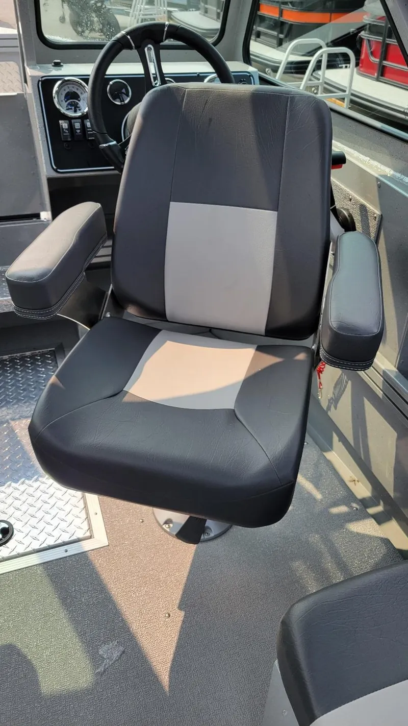 Slide: The Image of Captain's chair in 2026 Smoker Craft Phantom 18 X2 boat, featuring Yamaha 150 hp engine. - 24