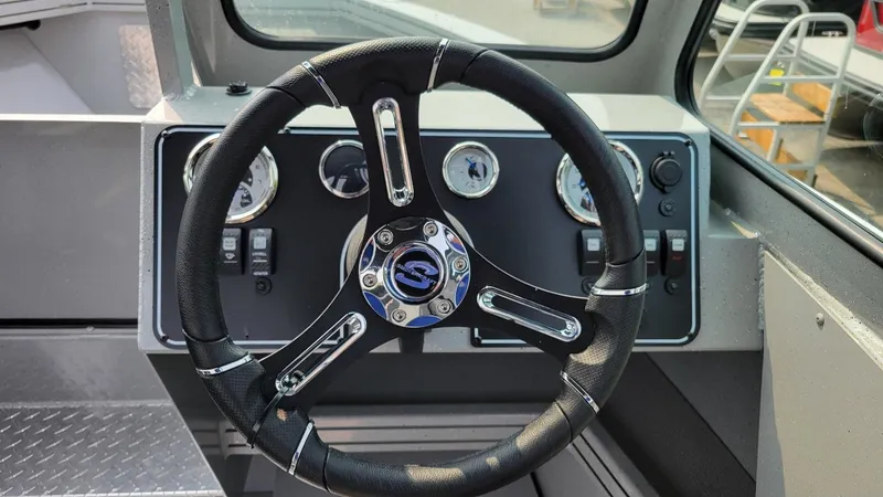 Slide: The Image of Steering wheel and dashboard of 2026 Smoker Craft Phantom 18 X2 boat. - 25