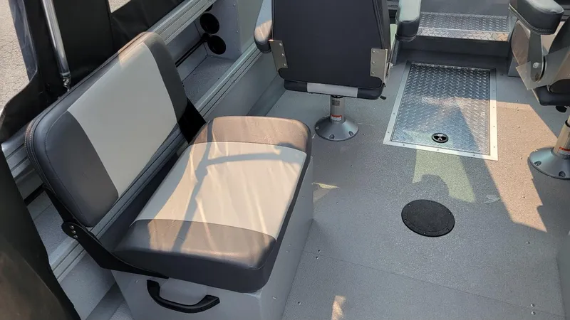 Slide: The Image of Interior of 2026 Smoker Craft Phantom 18 X2 boat, featuring seating and metal flooring. - 28