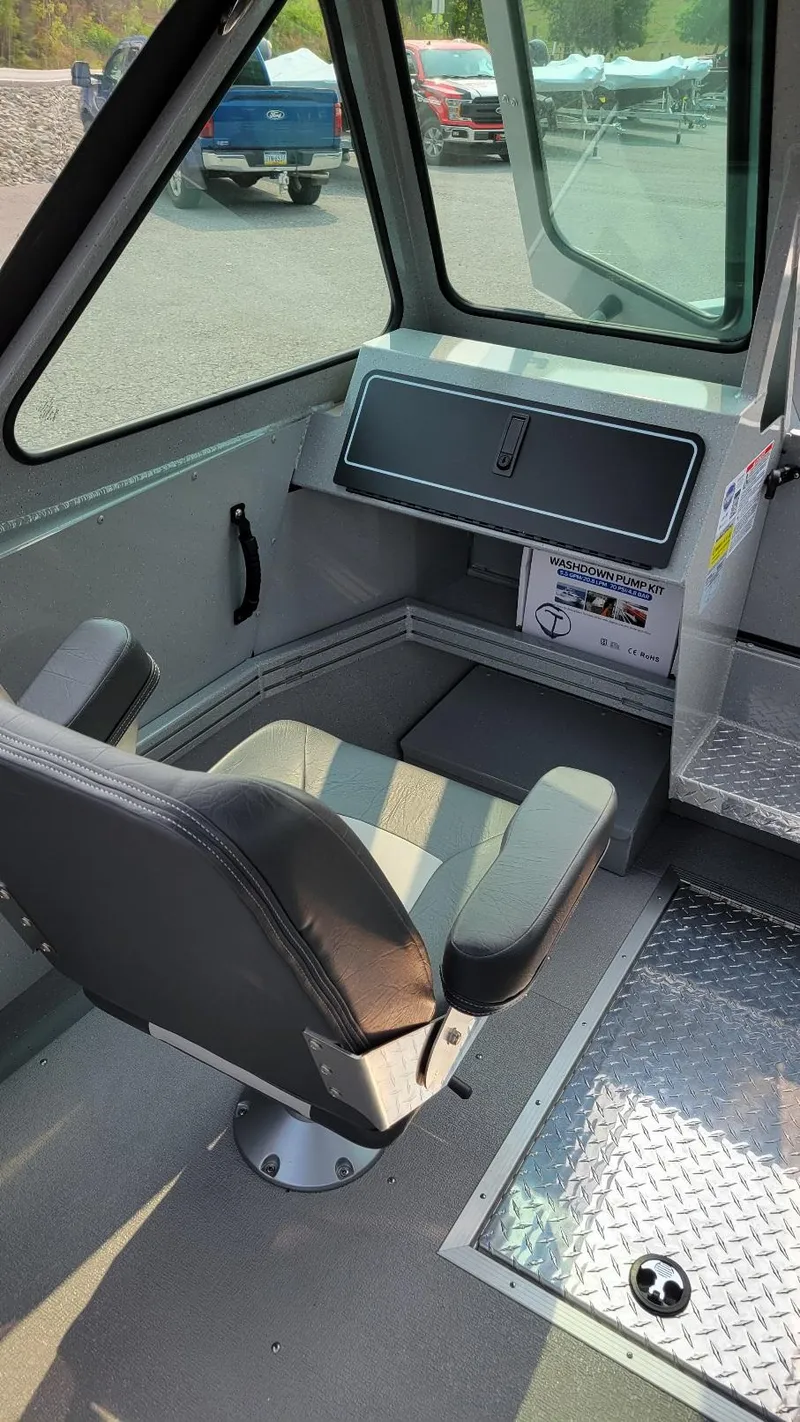 Slide: The Image of 2026 Smoker Craft Phantom 18 X2 interior with seating and dashboard. - 6